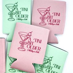 four pink and green cocktail coasters with the words,'tint'n'older on them