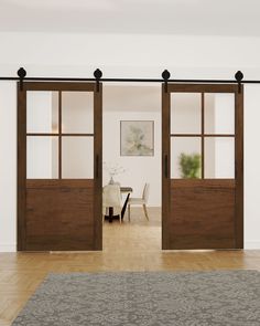 the sliding doors are open and ready to be used as an office or dining room