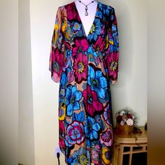 Beautiful Silk/Rayon Dress. Made In Italy I Didn’t Know It Was Part Rayon At All Because The Dress And Lining Feel Like Silk. Gorgeous Floral Blue And Pink On Gold Background. Empire Waist. Flows Like A Dream. Size Large. Elastic Waist Makes It Very Adjustable. Never Worn New With Tags. Colorful Floral Print V-neck Dress, Colorful Floral Print Dress For Brunch, Colorful Floral Print Midi Dress For Beach, Pink Vibrant Print Dress For Beach Cover-up, Colorful V-neck Dress With Floral Print, Colorful Floral Print V-neck Maxi Dress, Pink V-neck Maxi Dress With Vibrant Print, Vibrant Print Long Sleeve Beach Dress, Multicolor Lined V-neck Maxi Dress