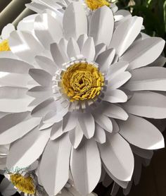 white and yellow paper flowers in a vase