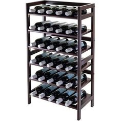 a wooden wine rack filled with lots of bottles on top of eachother in front of a white background