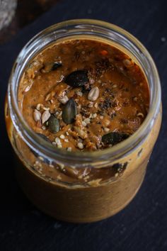 a jar filled with food sitting on top of a table