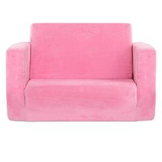 a pink couch sitting on top of a white floor