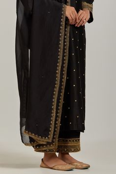 Black chanderi silk kurta with sequin, floral embroidery and V neckline. Paired with pant and dupatta.
Component: 3
Pattern: Embroidery
Type Of Work: Floral, sequin
Neckline: V neck
Sleeve Type: Long sleeves
Fabric: Chanderi Silk
Color: Black
Other Details: 
Embroidered sheer dupatta
Occasion: Sangeet - Aza Fashions Semi-stitched Slub Silk Sets With Dori Work, Designer Chanderi Kurta With Dabka Work, Festive Cotton Silk Palazzo Set With Dupatta, Unstitched Silk Traditional Wear With Dabka Work, Festive Unstitched Raw Silk Palazzo Set, Designer Cotton Silk Palazzo Set With Dupatta, Raw Silk Cutdana Unstitched Sets, Raw Silk Traditional Wear For Eid, Bollywood Silk Set With Zari Work