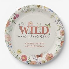 a floral plate with the words wild and beautiful on it