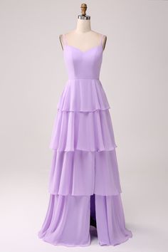 a purple dress on a mannequin headdress with ruffles and straps