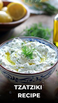 a bowl filled with white sauce and garnished with green sprinkles