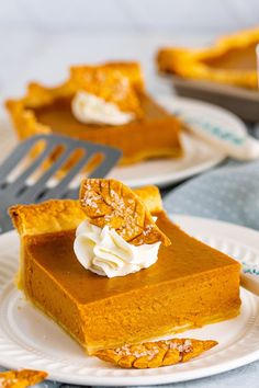 a slice of pumpkin pie with whipped cream on top