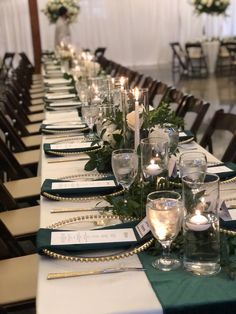 a long table is set with candles and place settings