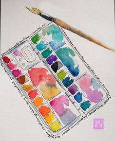 watercolor paints and a brush are sitting on top of a piece of paper