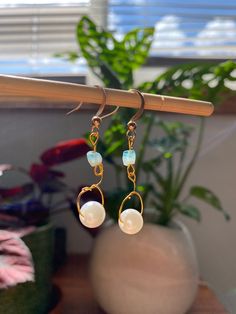 These gold pearl and blue glass bead earrings are a perfect staple in your closer and match with any outfit.  Channel the summer tropical beach vibes with these dainty minimalist earrings.  Handmade with care and detail, these will make you shine at any event, and are a great gift for her. Mermaidcore and cottage core vibes commence! Drop length: 2.2 in Free shipping on all my products 🍊🧡and a 21 day return and exchange policy. Don't hesitate to reach out to me for any questions! Gold Pearl Earrings As Summer Gift, Gold Pearl Earrings For Summer Gifts, Gold Pearl Earrings Perfect For Summer Gifts, Summer Pearl Dangle Earrings, Summer Pearl Drop Dangle Earrings, Elegant Wire Wrapped Earrings For Summer, Handmade 14k Gold Filled Earrings For Beach, Elegant Summer Wire Wrapped Earrings, Handmade 14k Gold Filled Beach Earrings