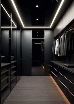 an empty walk in closet with black walls