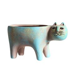 a ceramic cat planter sitting on top of a table