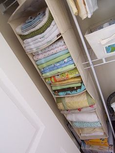 the closet is full of folded towels and other things to use as storage for blankets