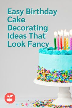 a birthday cake with lit candles on it and the words easy birthday cake decorating ideas that look fancy