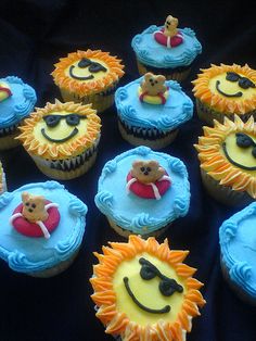 cupcakes decorated with smiley faces and other decorations