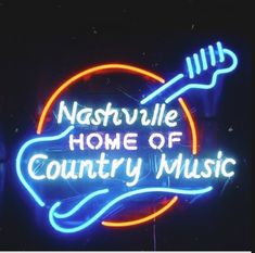 a neon sign that says nashville home of country music