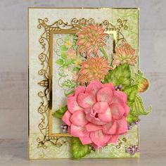 a close up of a card with flowers on the front and back side, in an ornate frame