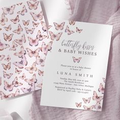 two cards with pink butterflies on them and the words butterfly kisses and baby wishes written in white