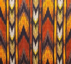 an orange, yellow and black pattern on fabric