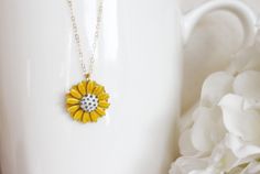 "This pendant is from my vintage garden collection, sweet adorable tiny yellow enamel daisy measures 50\" in diameter. Hangs from a new 14 karat gold filled cable chain . Spring closure clasp. The Daisy is vintage an in mint condition The model is wearing a 16\" length. H A N D M A D E * We hand make all pieces in our Water Mill New York studio * We source eco friendly packaging and materials, including recyclable mailers! FREE BOX AND WRAP ON EVERY ORDER P R O D U C T I O N ∙ T I M E S All item Cute Gold Jewelry With Vintage Charm, Dainty Yellow Flower Shaped Jewelry, Vintage Gold Jewelry With Sunflower Design, Gold Flower Necklace With Vintage Charm, Vintage Yellow Enamel Jewelry, Yellow Flower-shaped Enamel Jewelry, Dainty Yellow Flower Necklace, Cute Yellow Flower Shaped Jewelry, Yellow Enamel Flower Shaped Jewelry