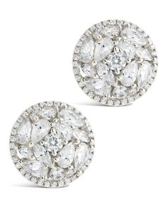 These fun, celebrity-inspired Zara Circle Studs will make you feel like a movie star! Featuring a unique CZ stone design, you can wear these flashy statement earrings on the red carpet and turn heads like the gorgeous A-listers you admire. Unforgettable glam, coming your way! Materials: 14K gold or rhodium plated brass, cubic zirconia Features: 0.6" stud, 1mm-5mm stones, Lead & Nickel free, hinged post back Glamorous Cubic Zirconia Cluster Earrings, Silver Glamorous Cluster Earrings For Party, Dazzling Sparkling Cluster Earrings For Party, Glamorous White Cluster Earrings For Party, Glamorous Sparkling Cluster Earrings For Party, Glamorous Party Cluster Earrings With Sparkling Stones, Dazzling Cluster Earrings For Party, Round Cluster Earrings With Sparkling Stones For Party, Sparkling Stones Cluster Earrings For Party