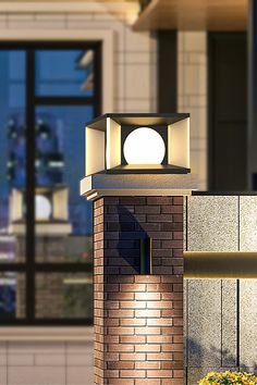 a light that is on the side of a brick pillar in front of a building