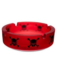 a red bracelet with black skulls and bones on the side, in front of a white background