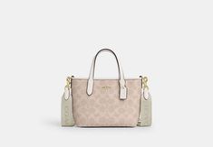 City Mini Tote Bag In Signature Canvas | COACH OUTLET Coach Small City Tote, Coach Mini City Tote, Coach Dempsey Tote 22 White, Coach Cargo Tote, White Tote Shoulder Bag With Gold-tone Hardware, Sling Bag Mini, Sustainable Bag, Coach Outlet, Signature Canvas