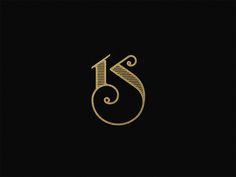 the letter s is inscribed in gold on a black background