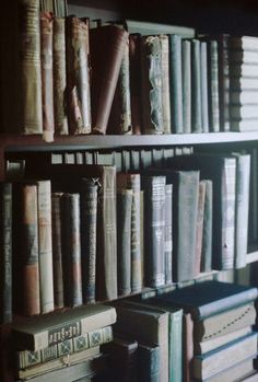 an old bookshelf filled with lots of books on top of each book shelf