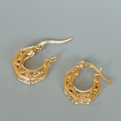 A PAIR of filigree sterling silver ear hoops. These hoops are dipped in gold. Size: 16 x 14 x4 mm Weight: 2.95 gm Price listed is for ONE PAIR These are made of 925 hypoallergenic sterling silver. Most of my pieces come with a 925 stamp. Can be packaged in a gift box. I can include a personal message from you if needed You are welcome to contact me at... bhavnakwintra1956@gmail.com For more beautiful pieces from my shop, please browse 👇 TOE RINGS: https://www.etsy.com/your/shops/TheSilverGame/t Anniversary Gold Huggie Earrings Pierced, Nickel Free Gold Plated Round Huggie Earrings, Gold Plated Hoop Earrings With Ear Wire For Anniversary, Gold Hypoallergenic Hoop Earrings For Anniversary, Gold Dainty Hoop Earrings Nickel Free, Gold Pierced Huggie Earrings, Anniversary Metal Huggie Earrings For Pierced Ears, Gold-plated Small Hoop Earrings, Gold Plated Round Huggie Earrings With Lever Back