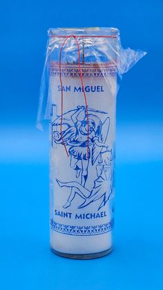 a candle wrapped in plastic on a blue background