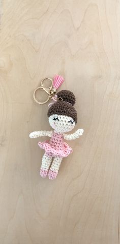 a crocheted key chain with a ballerina doll on it