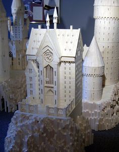 a model of a castle made out of wood blocks and paper machs on display