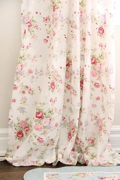 a white curtain with pink flowers on it