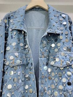 The intricate diamond shaped rhinestone sequin design adds a touch of elegance to the old blue denim, making it a versatile and stylish addition to any wardrobe. Enjoy the timeless appeal and sparkling accents of this jacket. - Color: Blue- Style: Denim Jacket- Pattern Type: Rhombus- Sleeve Length: Long Sleeve- Neckline: Collar- Fabric: Denim- Closure Type: Buttons- Details: Rhinestones, Sequins- Fit Type: Loose Fit- Occasion: Casual- Gender: Women- Size: S, M, L, XLSuggested Weight:S: Within 50KGM: Within 55KGL: Within 60KGXL: Within 65KG Embellished Medium Wash Denim Jacket, Embellished Blue Denim Outerwear, Spring Rhinestone Denim Jacket, Blue Embellished Denim Outerwear, Trendy Embellished Blue Outerwear, Blue Denim Embellished Outerwear, Spring Denim Jacket With Rhinestones, Trendy Blue Embellished Outerwear, Fall Denim Jacket With Rhinestones