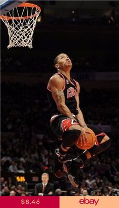 a basketball player jumping up into the air to dunk