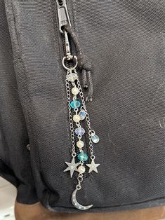 a close up of a person's back pocket with some charms attached to it