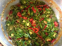 green and red peppers are mixed together in a bowl