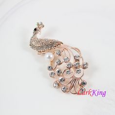 "LarkKing BH93 Peacock brooch, crystal peacock brooch, pearl peacock brooch, rhinestone peacock brooch, women gift, birthday gift. Material: brass metal, rhinestone crystals, pearl Size: 2 3/4\"x 1 3/8\" (width x height) Weight: 15.1 g (0.53OZ) Gift box is available at https://www.etsy.com/your/shops/LarkKing/tools/listings/section:22684027 LarkKing Sweet and sleek! All that jewelry. Meet the owner of LarkKing Learn more about the shop and process" Elegant Peacock-colored Brooches For Wedding, Elegant Peacock Brooches For Wedding, Elegant Peacock Color Wedding Brooches, Peacock Colored Wedding Brooch Jewelry, Elegant Wedding Brooch With Peacock Design, Elegant Peacock Design Brooch For Wedding, Elegant Peacock Design Wedding Brooch, Wedding Brooch With Peacock Design, Elegant Peacock Color Party Brooches