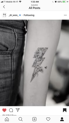 a woman's arm with a lightning tattoo on the left side of her arm