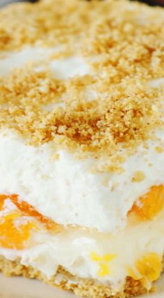 a close up of a dessert on a plate with crumbs and oranges