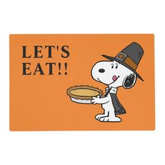 a cartoon dog holding a pie with the words let's eat on it