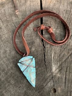 "This is my fresh spin on a wire wrapped classic. Arrowheads have been worn as jewelry for ages and are a recognizable symbol of alertness, walking the straight and narrow & strength. The arrowhead I used is made of jasper stone and is a hand knapped modern replica. It was made in the same tradition and with the same primitive techniques that early man used. I added a lovely pale turquoise & gold highlight patina then wire wrapped it with blackened (oxidized) copper wire. This is a great Artisan Adjustable Turquoise Pendant Necklace, Southwestern Style Adjustable Pendant Jewelry, Adjustable One-of-a-kind Turquoise Necklace For Festivals, Southwestern Hand Wrapped Adjustable Jewelry, Adjustable Southwestern Hand Wrapped Jewelry, Handmade Adjustable Southwestern Turquoise Necklace, Southwestern Adjustable Hand Wrapped Jewelry, Handmade Southwestern Adjustable Turquoise Necklace, Adjustable Southwestern Style Hand Wrapped Jewelry