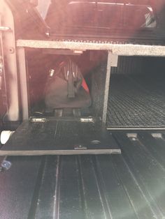 the back end of a truck with luggage in it