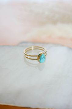 This dainty, pear shaped turquoise ring with a double band is the perfect simple, everyday design. Love it for its minimalistic style but with a pop of color! Please Note Turquoise is a natural stone and varies in color from blue to green and many shades in between. Some have matrix markings and some do not, each stone is different and unique. The stone you receive WILL vary from the photos listed. The photos are a representation of my stones, it DOES NOT mean it is the exact stone you will rece Turquoise Wedding Rings, Teal Jewelry, Turquoise Gold Ring, Natural Turquoise Stone, Gold Vermeil Jewelry, Ring Turquoise, Vermeil Jewelry, Turquoise Rings, Solid Gold Jewelry