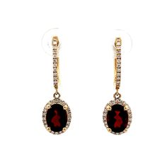 Oval Garnet & Diamond Earrings in 14k Yellow Gold These drop earrings are crafted in 14-karat yellow gold, featuring oval cut garnets as the centerpiece, weighing .60 carats. The garnets are surrounded by a halo of round brilliant cut diamonds, with a total weight of .37 carats with each diamond measuring 1.0 mm. The diamonds add sparkle, enhancing the rich color of the garnet. The earrings are secured with traditional post backings. PRIMARY STONE Stone: Garnet Shape: Oval Weight: .60 ct Measurements: 8.15 mm x 5.95 mm = .30 ct (2) ACCENT STONE Accent Stone: Natural Diamond Color and Clarity: G/H, SI1 Weight: .37 ct Measurements: 1.0 mm = .0054 ct (68) -- ALL PIECES ARE SUBJECT TO PRIOR SALE DUE TO HAVING A RETAIL LOCATION. -- 30-DAY RETURN POLICY FREE SHIPPING TO THE CONTINENTAL UNITED ST Wedding Jewelry Earrings, Round Brilliant Cut Diamond, Wedding Earrings, Oval Cut, Round Brilliant, Rich Color, Colored Diamonds, Natural Diamonds, Garnet