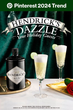 a bottle of hendrook's dazzle next to two glasses