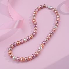 Choose this lavish AAA or AAAA multicolored freshwater pearl strand necklace for a dose of show-stopping color and mesmerizing uniqueness of these wondrous pearls. Colored pearls display harmonious body colors that uplift your wardrobe to another level of elegance. This classic single-strand necklace features completely natural lavender and pink fine quality AAA or AAAA pearls shimmering with pastel overtones and a bright luster. Unique and captivating, these high-quality lavender freshwater pea Pink Akoya Pearl Necklaces With Round Beads, Pink Akoya Pearl Round Bead Necklace, Elegant Multicolor High Luster Necklaces, Multicolor High Luster Necklace For Gift, Elegant Multicolor Jewelry With Pearl Charm, Multicolor High Luster Necklaces As Gift, Elegant Multicolor Pearl Charm Jewelry, Elegant Multicolor Single Strand Necklace, Pink Akoya Pearl Necklace With Round Beads